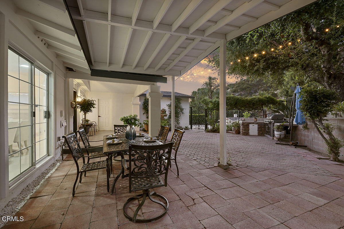 10842 Owens Place Tujunga, CA 91042 - Photo 47 of 68 a view of a patio with table and chairs and potted plants