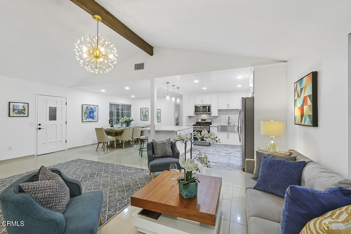 10842 Owens Place Tujunga, CA 91042 - Photo 6 of 68 a living room with furniture kitchen view and a chandelier