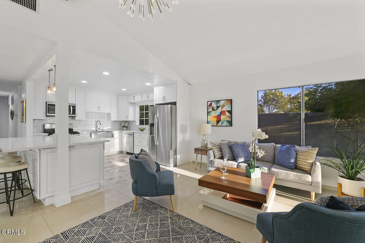 10842 Owens Place Tujunga, CA 91042 - Photo 10 of 68 a living room with furniture and a large window