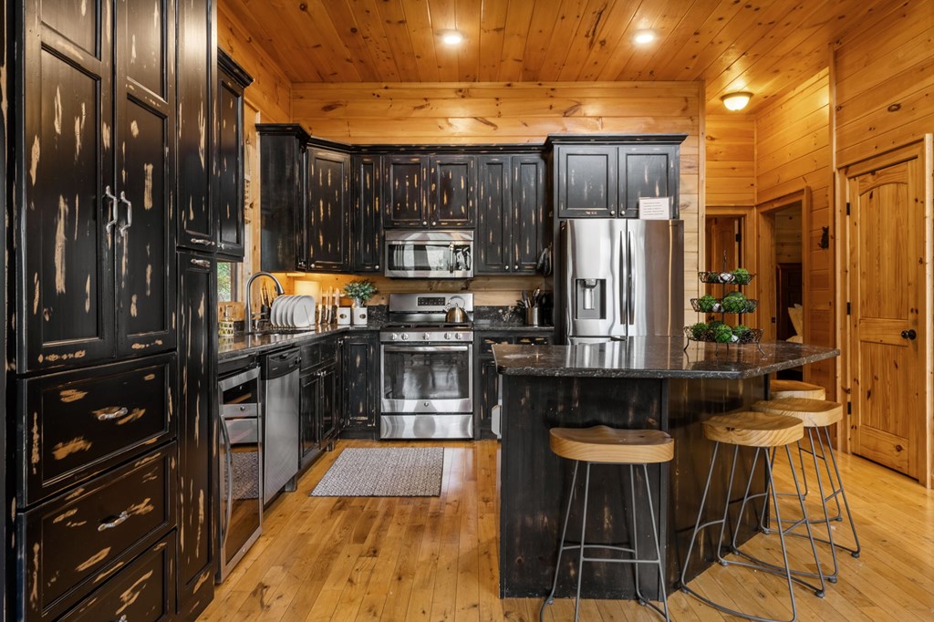 52 Whispering Lane Blue Ridge, GA 30513 - Photo 11 of 35 a kitchen with stainless steel appliances a refrigerator and a stove