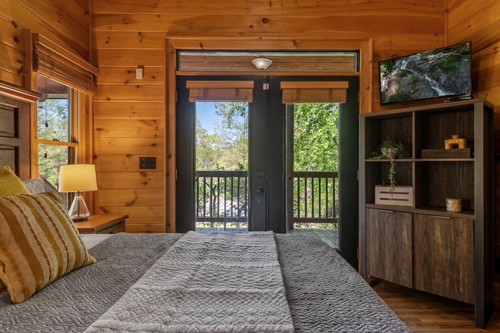 52 Whispering Lane Blue Ridge, GA 30513 - Photo 12 of 35 a bedroom with a bed and a window