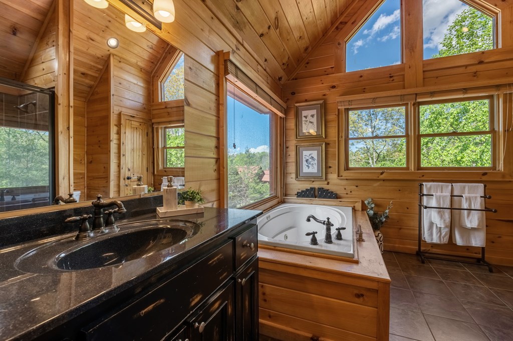 52 Whispering Lane Blue Ridge, GA 30513 - Photo 16 of 35 a bathroom with a sink and a large window