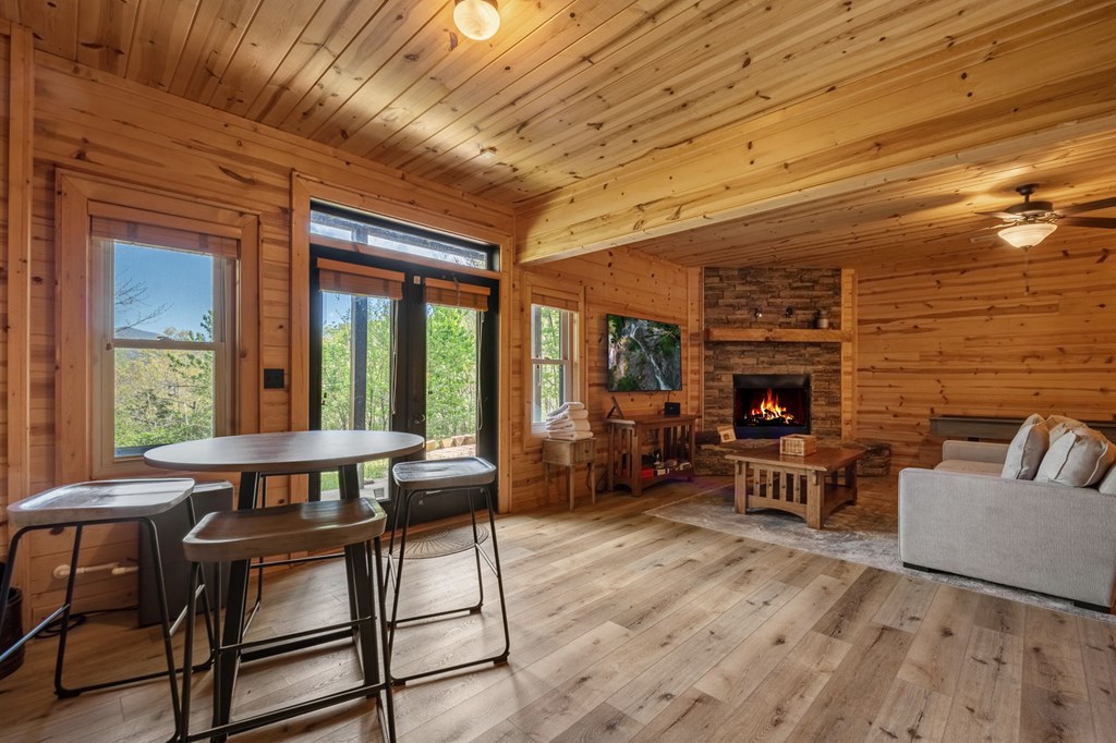 52 Whispering Lane Blue Ridge, GA 30513 - Photo 18 of 35 a living room with furniture a fireplace and a table