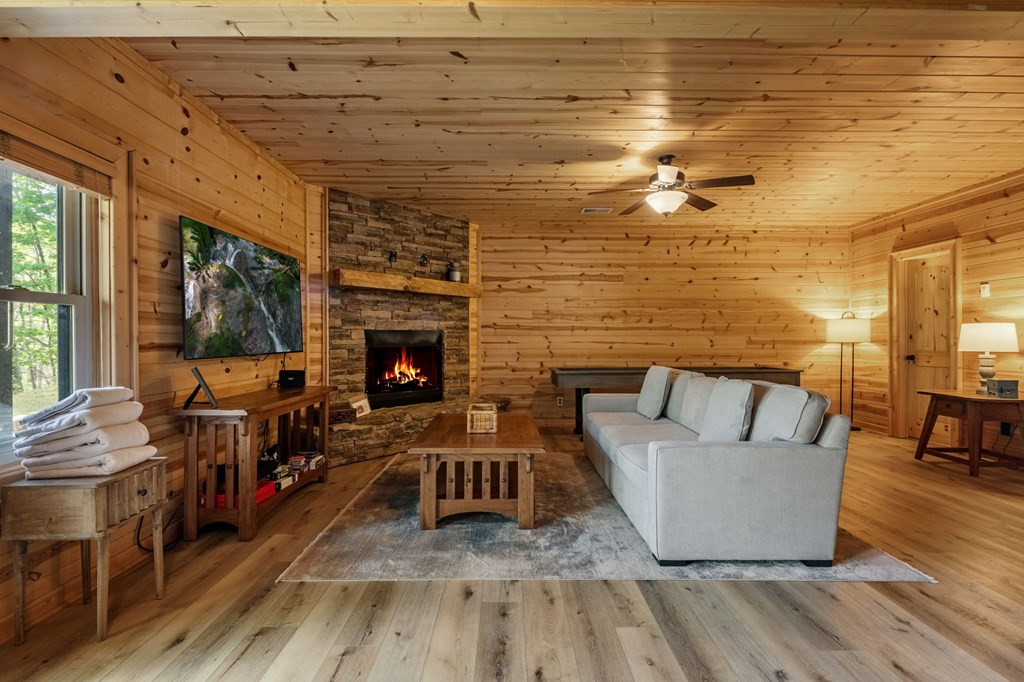 52 Whispering Lane Blue Ridge, GA 30513 - Photo 19 of 35 a living room with furniture and a fireplace