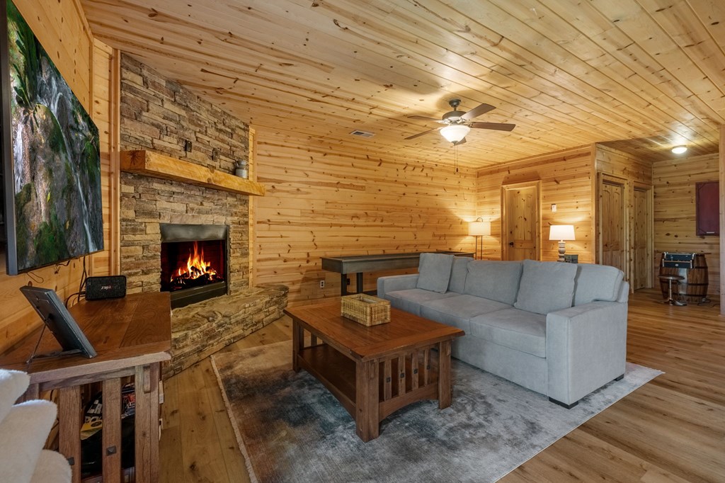 52 Whispering Lane Blue Ridge, GA 30513 - Photo 20 of 35 a living room with furniture and a fireplace