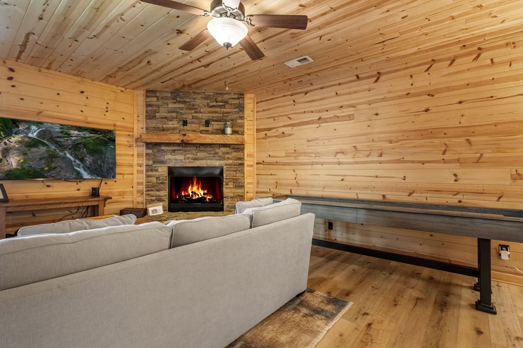 52 Whispering Lane Blue Ridge, GA 30513 - Photo 21 of 35 a living room with furniture and a fireplace