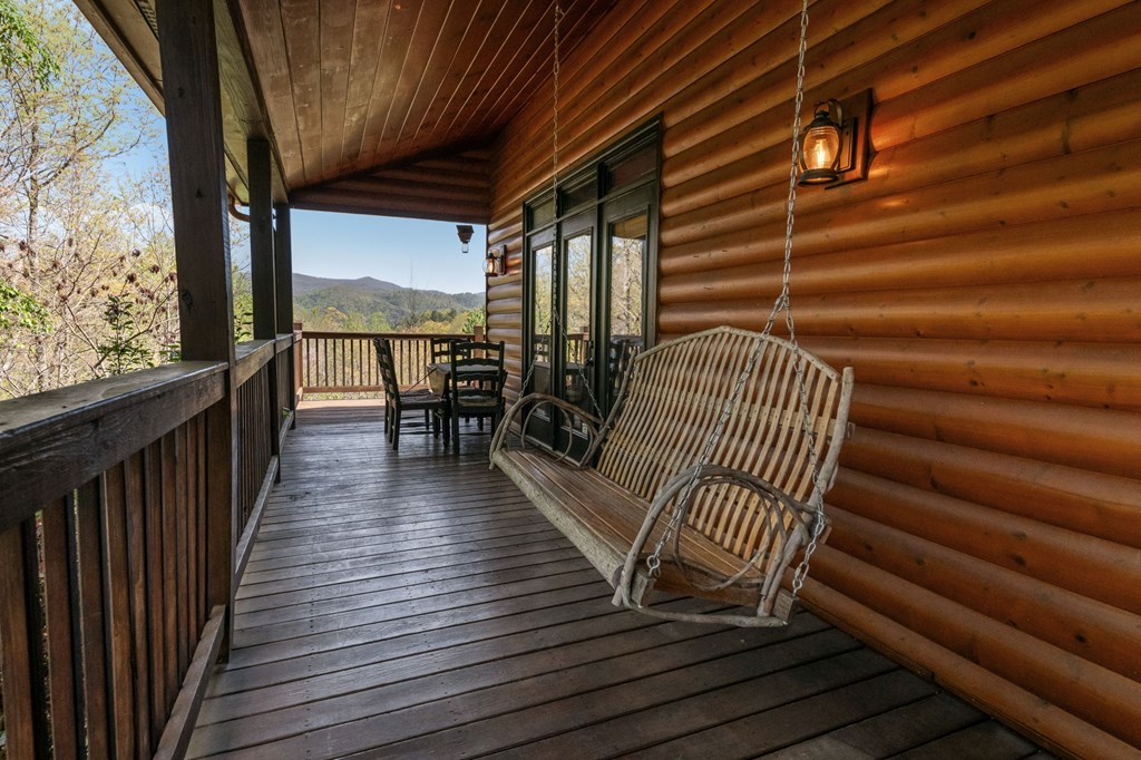 52 Whispering Lane Blue Ridge, GA 30513 - Photo 27 of 35 a view of deck with wooden floor and outdoor seating