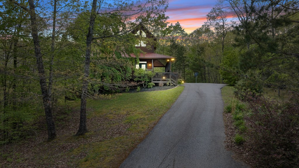 52 Whispering Lane Blue Ridge, GA 30513 - Photo 34 of 35 a view of a garden with a house