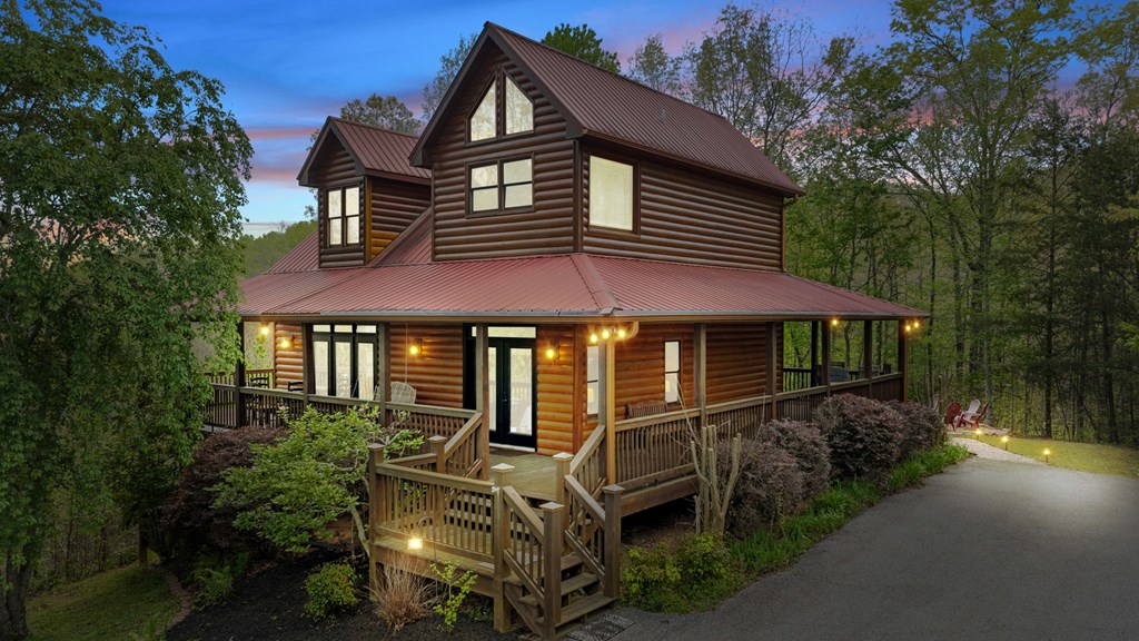 52 Whispering Lane Blue Ridge, GA 30513 - Photo 35 of 35 a front view of a house with garden