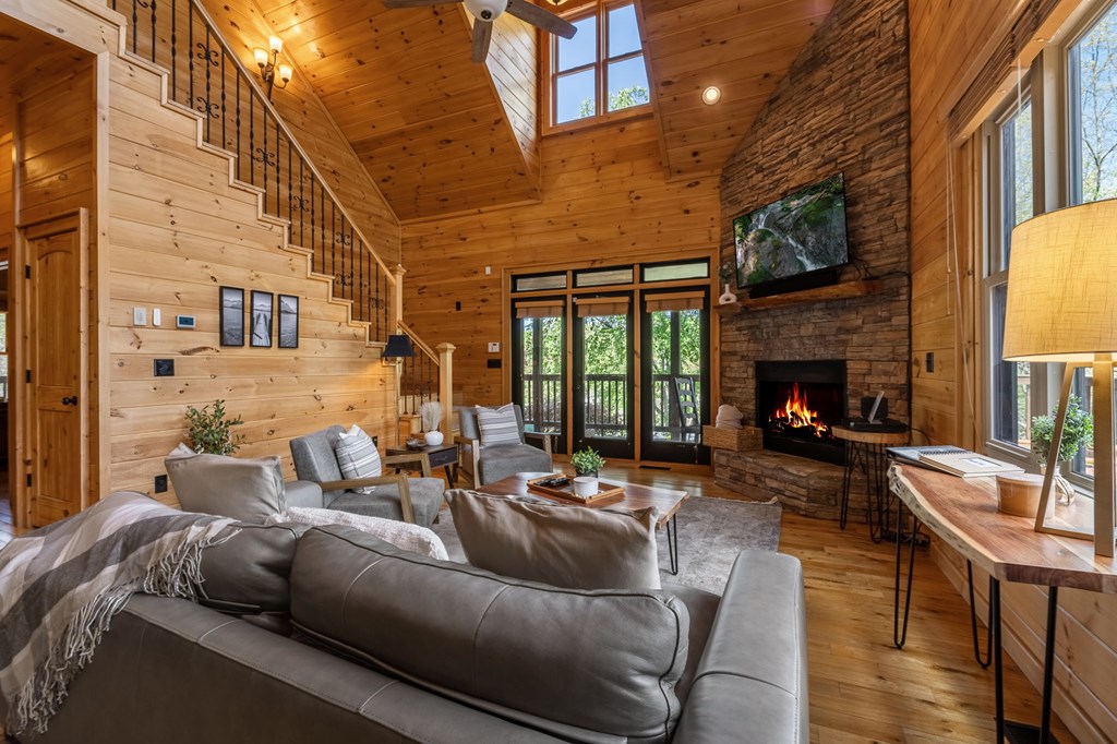 52 Whispering Lane Blue Ridge, GA 30513 - Photo 7 of 35 a living room with fireplace furniture and a fireplace