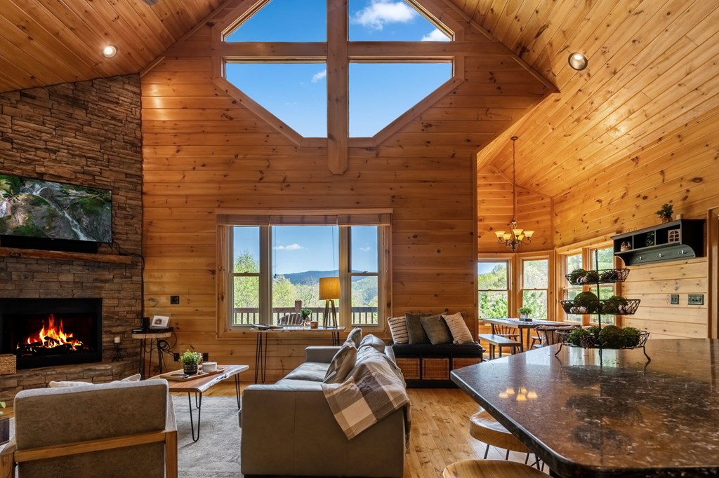 52 Whispering Lane Blue Ridge, GA 30513 - Photo 8 of 35 a living room with fireplace furniture and a fireplace