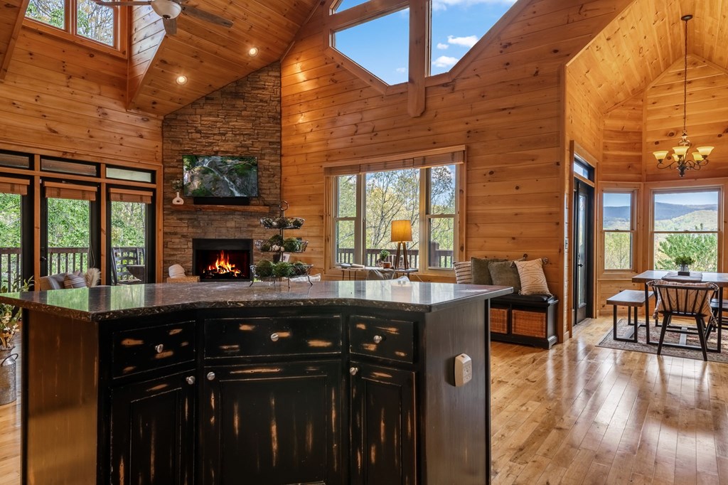 52 Whispering Lane Blue Ridge, GA 30513 - Photo 9 of 35 a open kitchen with stainless steel appliances granite countertop a stove and cabinets with wooden floor