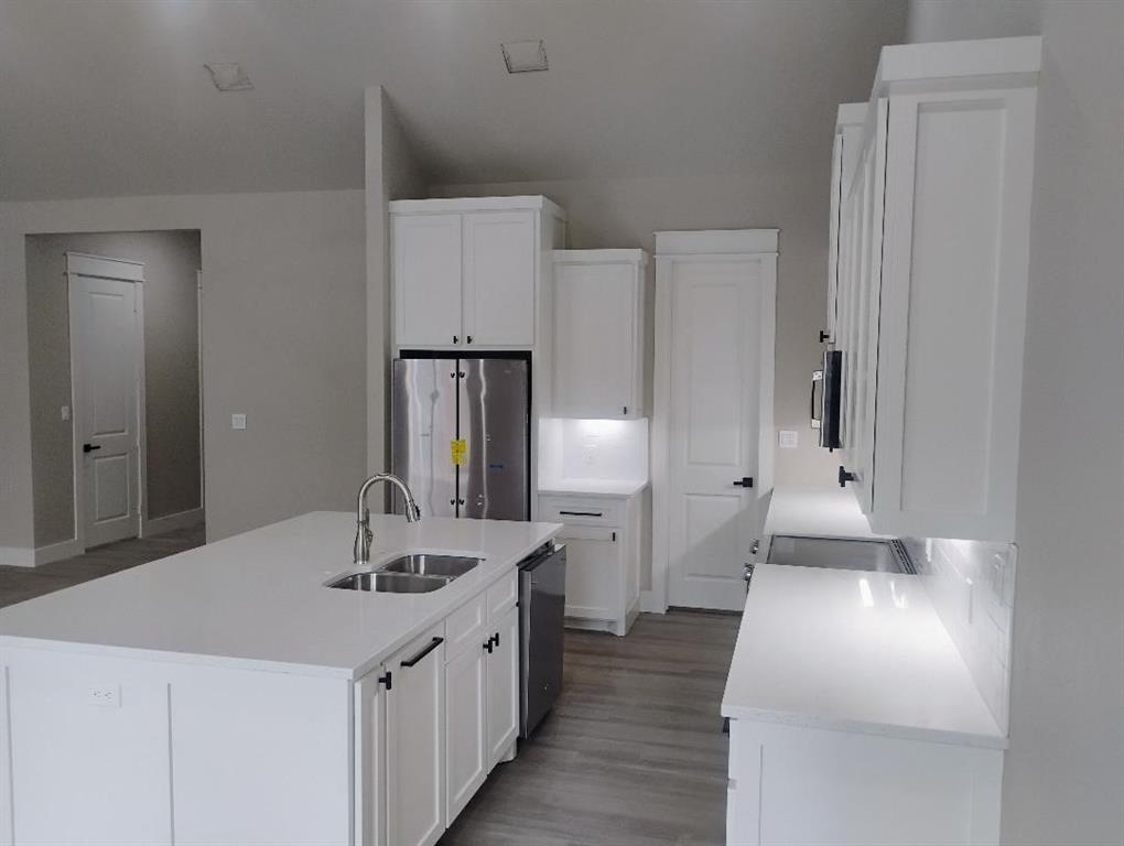 146 Hauser Place Runaway Bay, TX 76426 - Photo 13 of 15 a bathroom with double vanity and mirrors