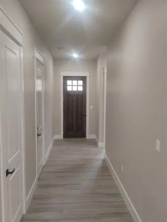 a view of entryway with wooden floor