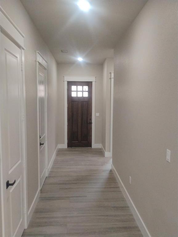 146 Hauser Place Runaway Bay, TX 76426 - Photo 15 of 15 a view of entryway with wooden floor