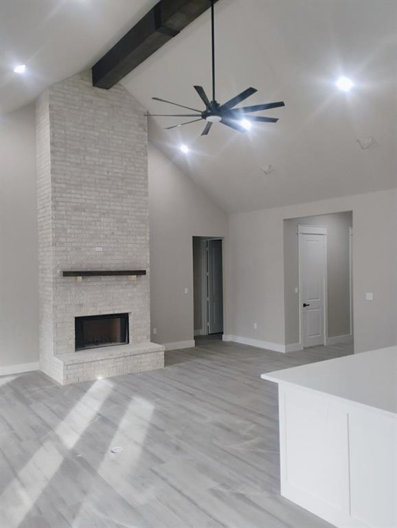 146 Hauser Place Runaway Bay, TX 76426 - Photo 3 of 15 a view of an empty room with a fireplace
