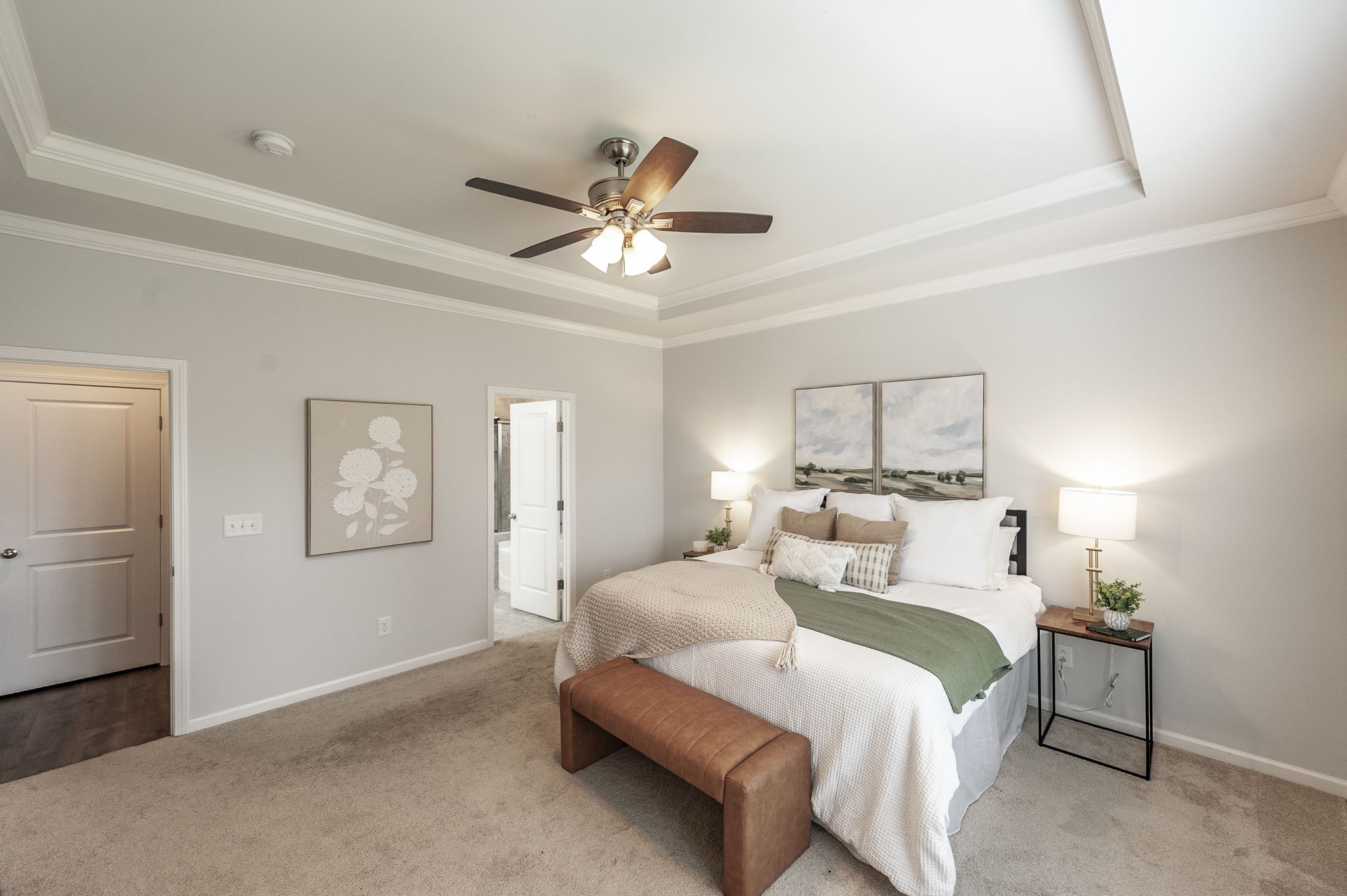 1095 Brixworth Drive Spring Hill, TN 37174 - Photo 20 of 49 a bedroom with a large bed and a chandelier