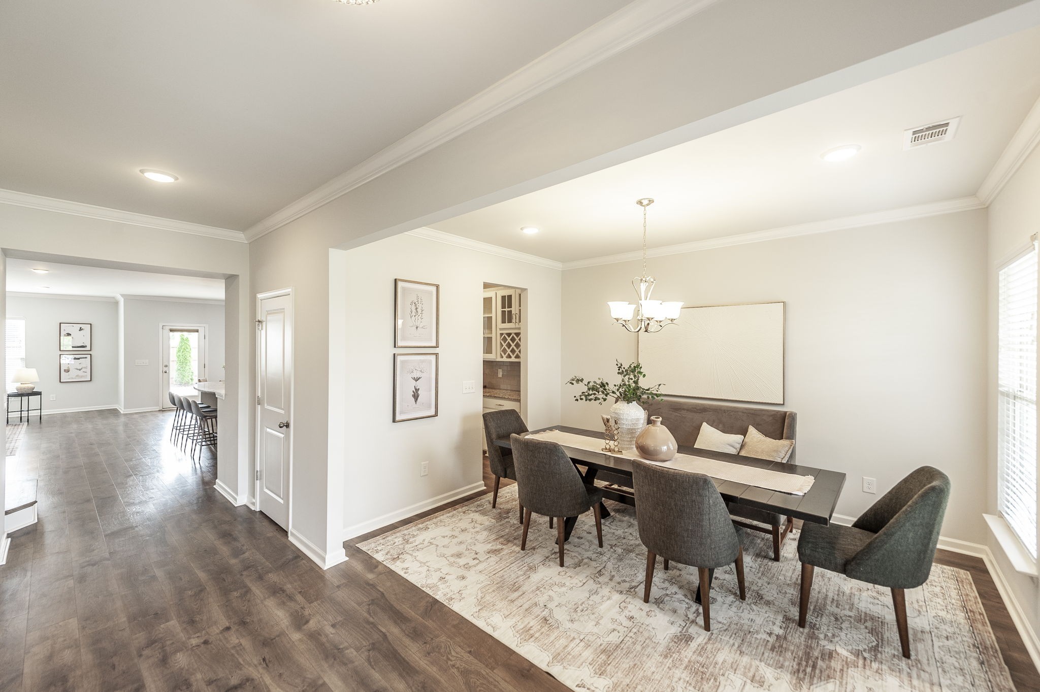 1095 Brixworth Drive Spring Hill, TN 37174 - Photo 2 of 49 a dining room with furniture and wooden floor