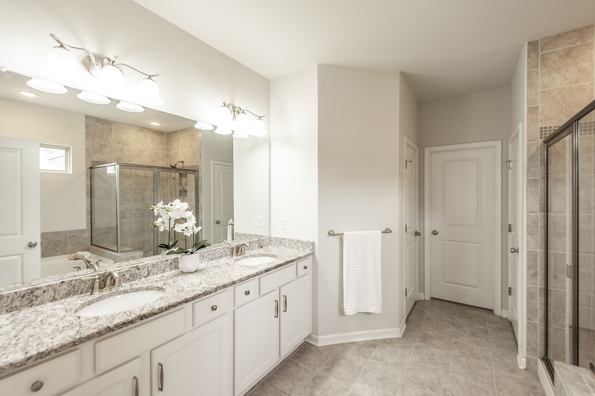 1095 Brixworth Drive Spring Hill, TN 37174 - Photo 22 of 49 a bathroom with double sink and a mirror