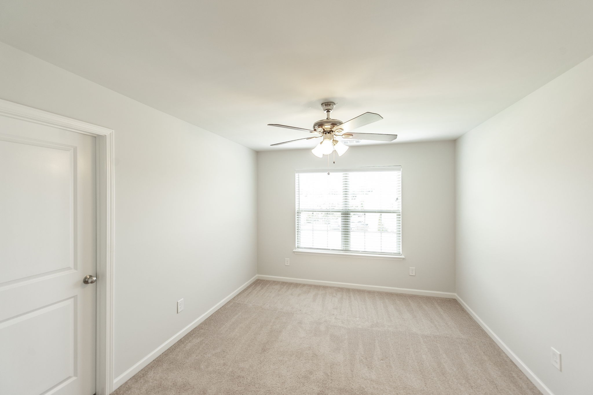 1095 Brixworth Drive Spring Hill, TN 37174 - Photo 29 of 49 an empty room with windows and chandelier fan