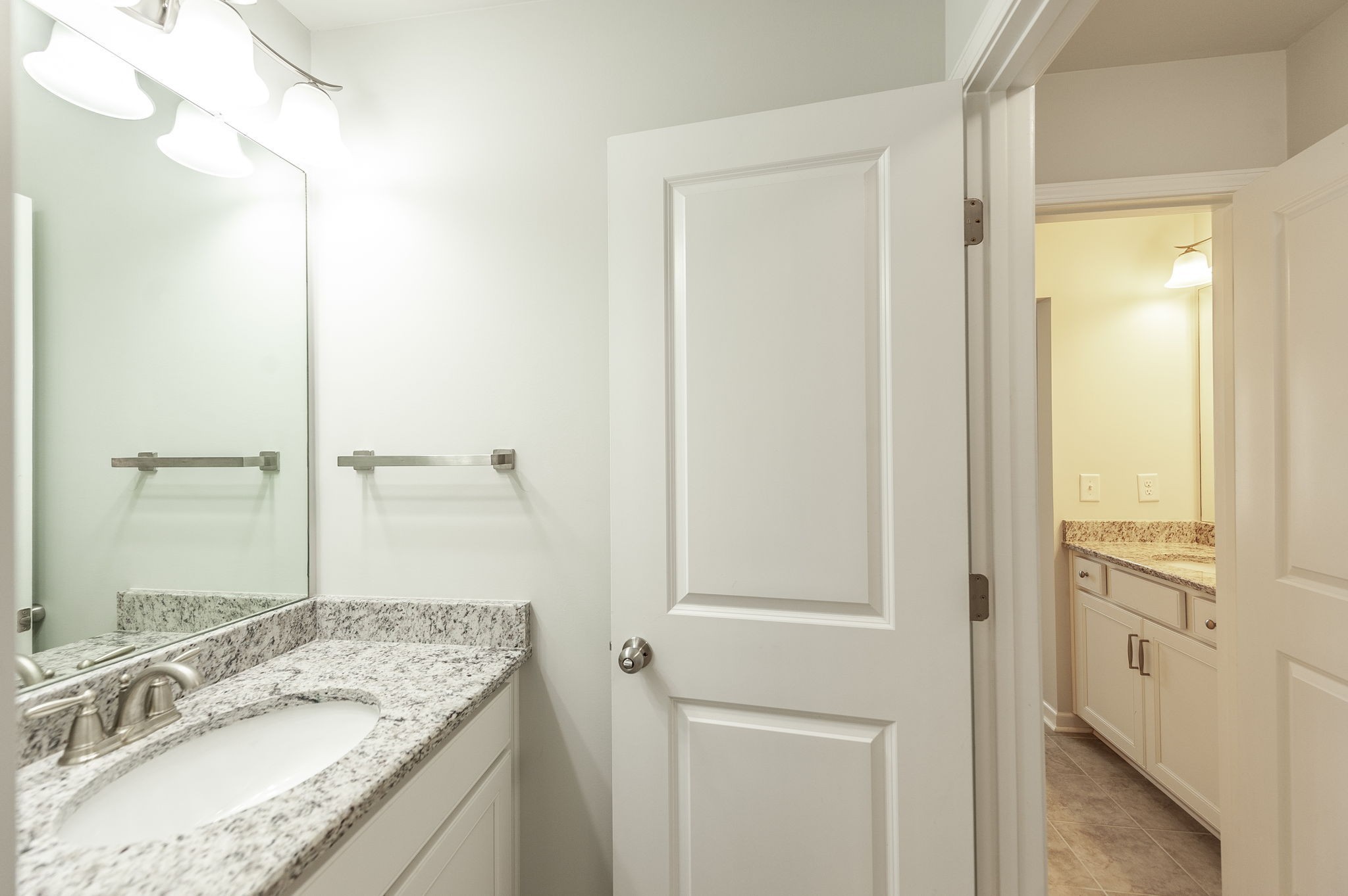 1095 Brixworth Drive Spring Hill, TN 37174 - Photo 30 of 49 a bathroom with a granite countertop sink a mirror and a shower