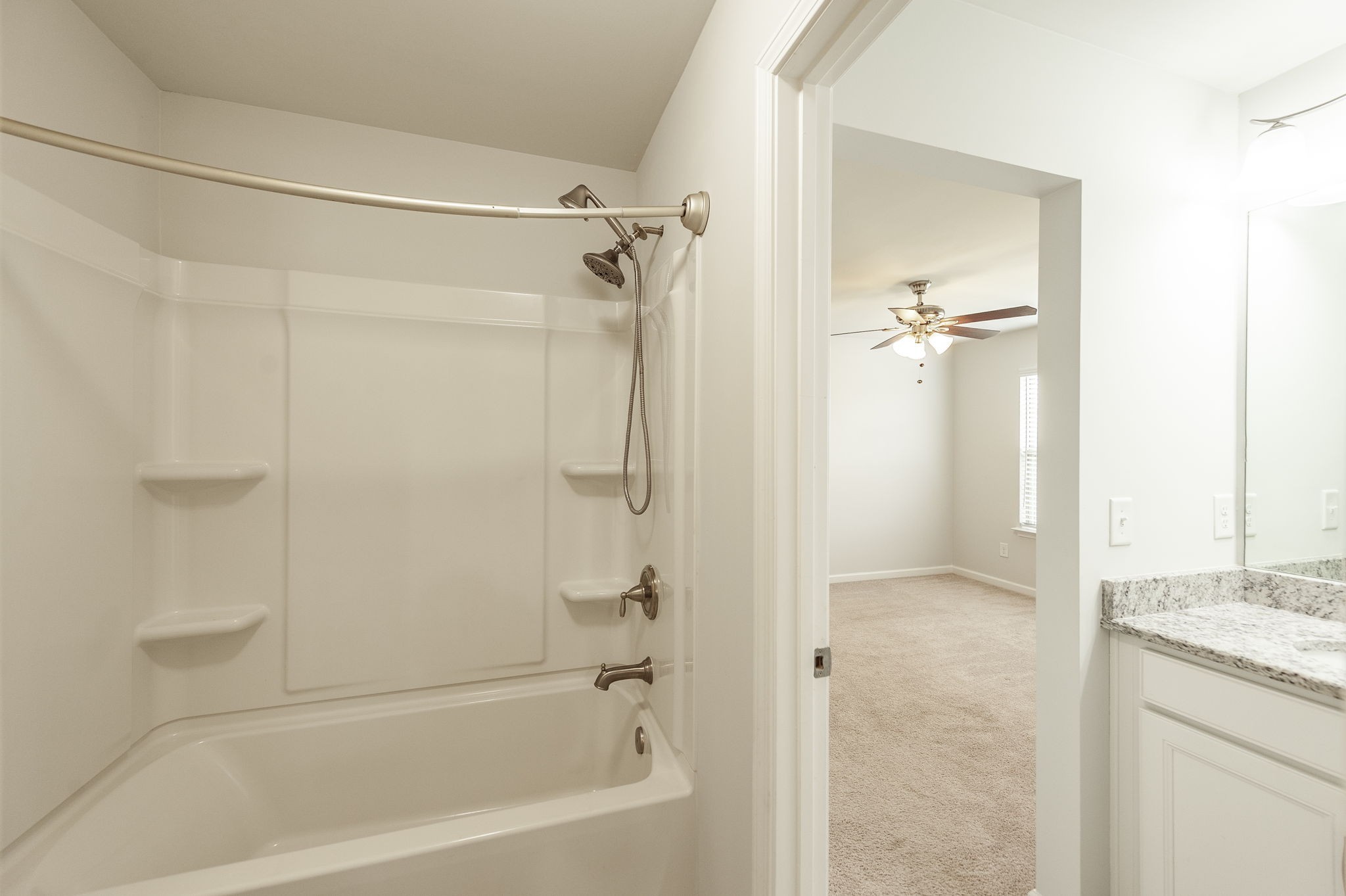 1095 Brixworth Drive Spring Hill, TN 37174 - Photo 31 of 49 a bathroom with a granite countertop shower a mirror and a sink