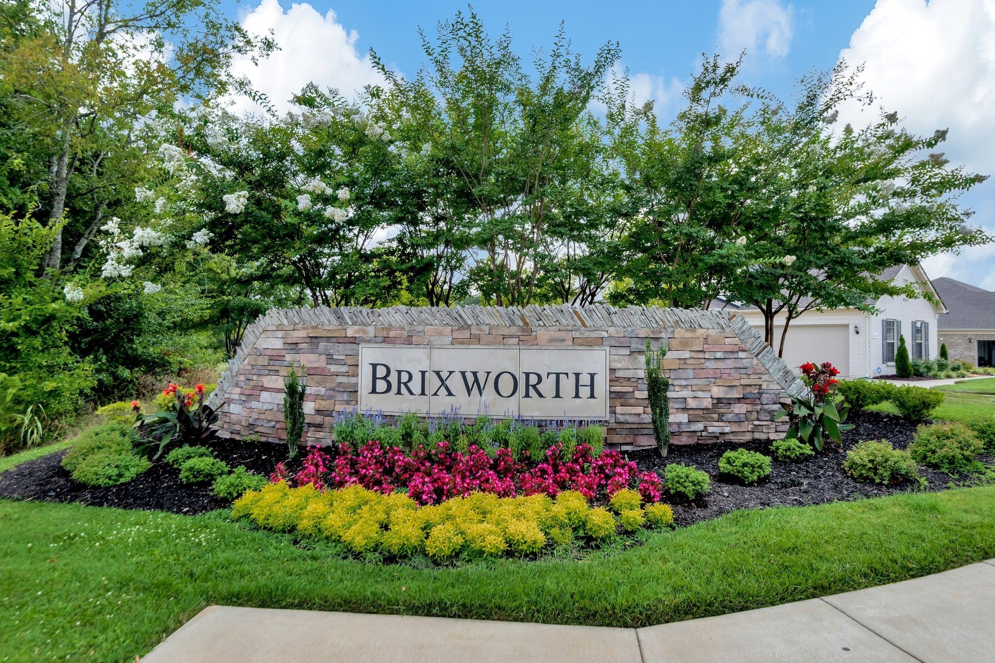 1095 Brixworth Drive Spring Hill, TN 37174 - Photo 49 of 49 a view of a sign in front of flowers