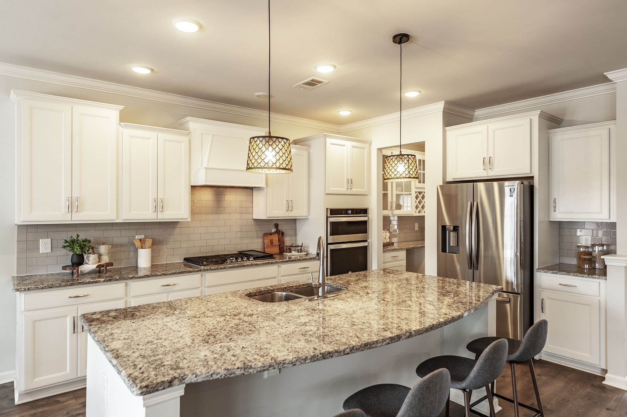 1095 Brixworth Drive Spring Hill, TN 37174 - Photo 7 of 49 a kitchen with stainless steel appliances granite countertop a sink refrigerator and microwave