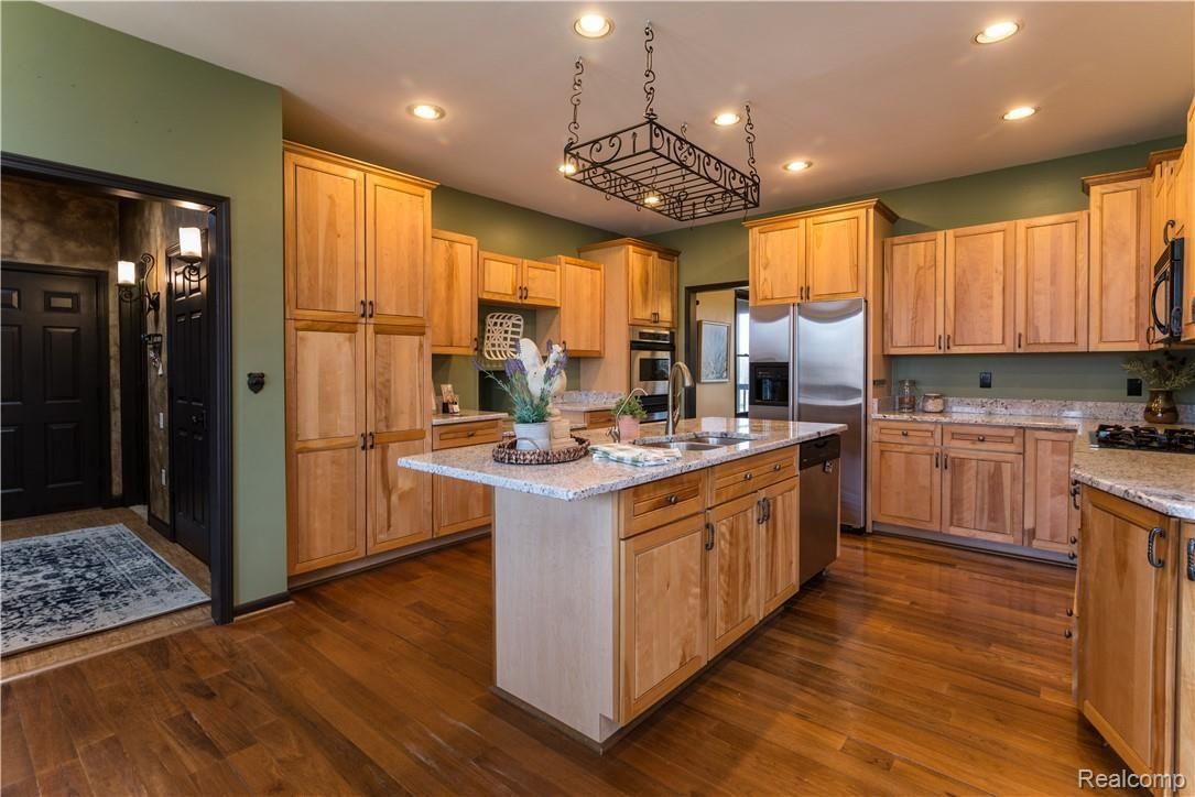 4760 Winding Way Howell, MI 48843 - Photo 12 of 59 Kitchen featuring Granite Counters, Custom Cabinets & Stainless Steal Appliances