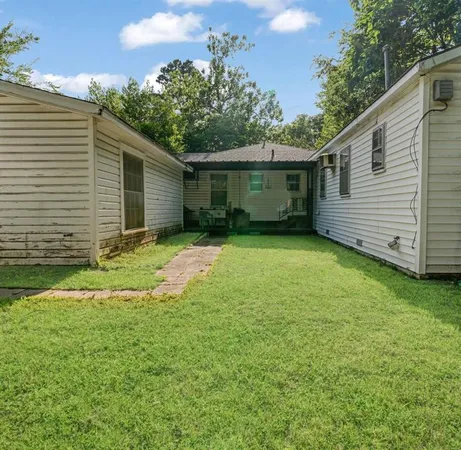 a view of a backyard with a garden