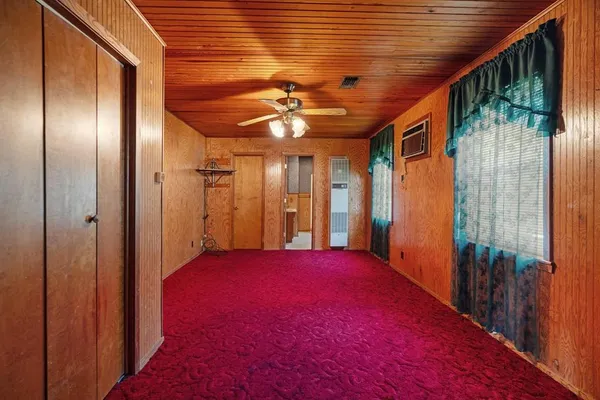 a view of backyard with a large window and chandelier