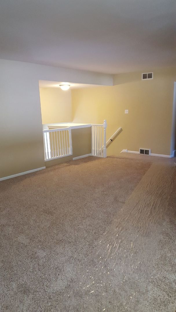 457 Galahad Road Bolingbrook, IL 60440 - Photo 7 of 14 a view of an empty room with a window