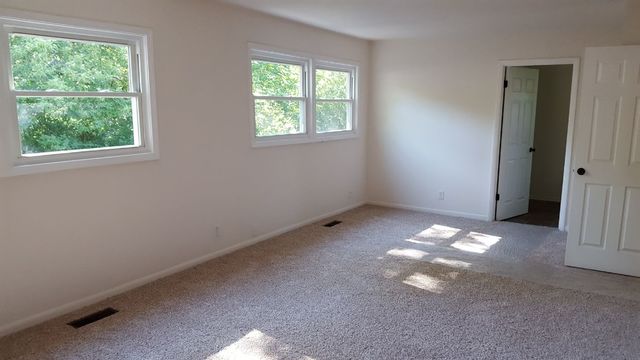 457 Galahad Road Bolingbrook, IL 60440 - Photo 9 of 14 a view of an empty room with a window