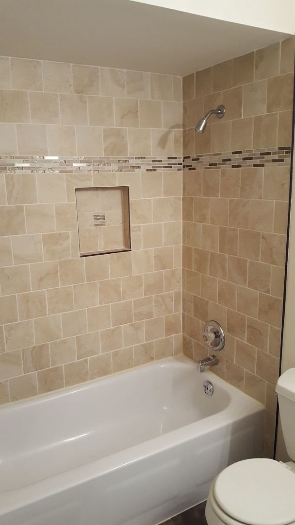 457 Galahad Road Bolingbrook, IL 60440 - Photo 10 of 14 a white bath tub sitting next to a white toilet