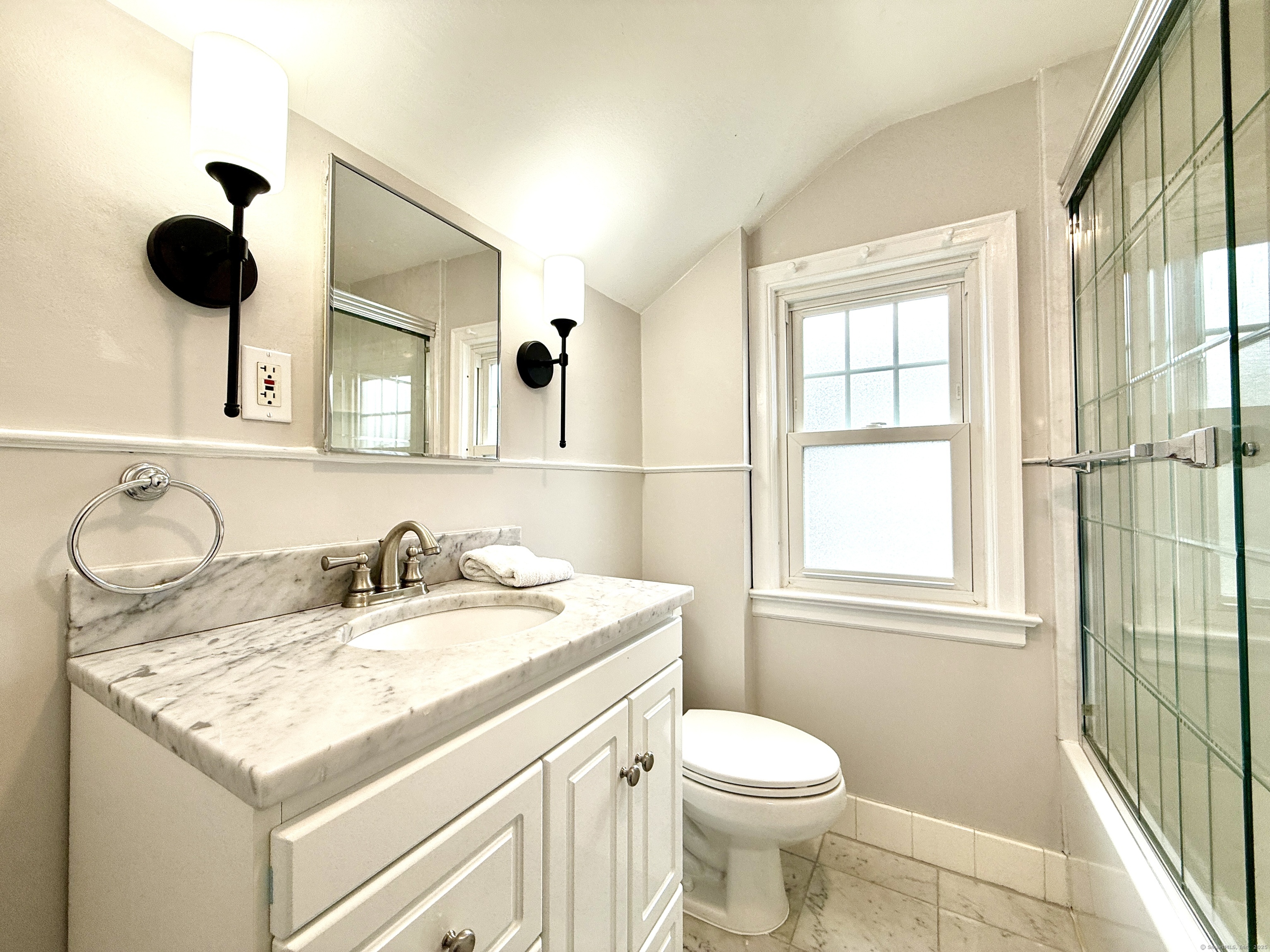 467 Wilson Street Fairfield, CT 06825 - Photo 16 of 18 a bathroom with a granite countertop sink toilet and mirror