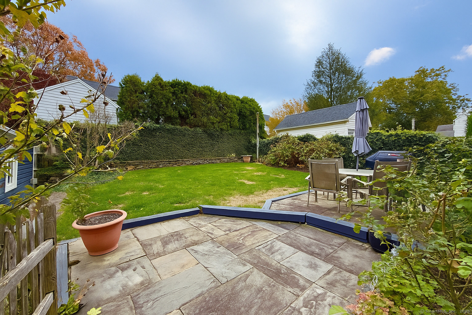467 Wilson Street Fairfield, CT 06825 - Photo 18 of 18 a view of a backyard with sitting area