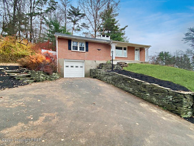 7522 Old Coach Road Stroudsburg, PA 18360 - Photo 13 of 68 a front view of a house with a yard