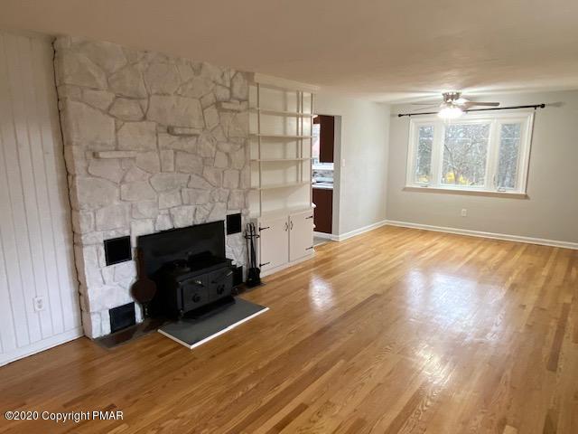 7522 Old Coach Road Stroudsburg, PA 18360 - Photo 36 of 68 a living room with a fireplace