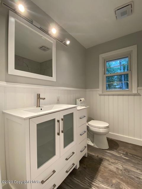 7522 Old Coach Road Stroudsburg, PA 18360 - Photo 41 of 68 a spacious bathroom with a toilet sink and mirror