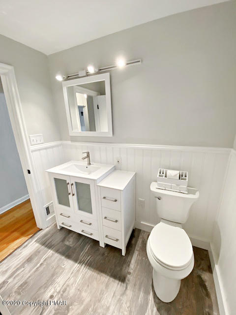 7522 Old Coach Road Stroudsburg, PA 18360 - Photo 42 of 68 a white toilet sitting next to a bathroom sink