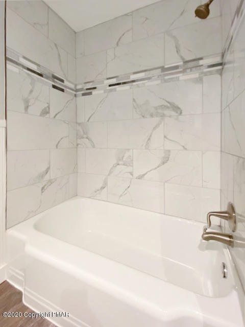 7522 Old Coach Road Stroudsburg, PA 18360 - Photo 46 of 68 a bathroom with a shower and a bath tub
