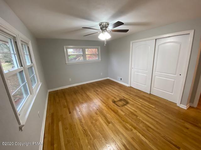 7522 Old Coach Road Stroudsburg, PA 18360 - Photo 54 of 68 a bedroom with a bed and a window