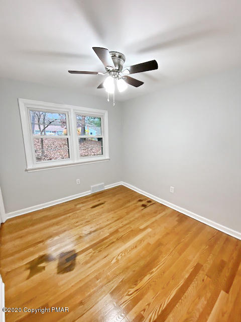 7522 Old Coach Road Stroudsburg, PA 18360 - Photo 62 of 68 a view of an empty room with window and ceiling fan