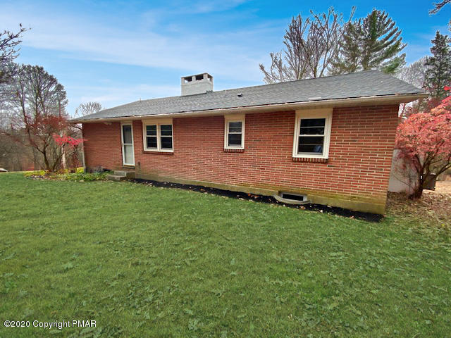 7522 Old Coach Road Stroudsburg, PA 18360 - Photo 7 of 68 a front view of house with yard