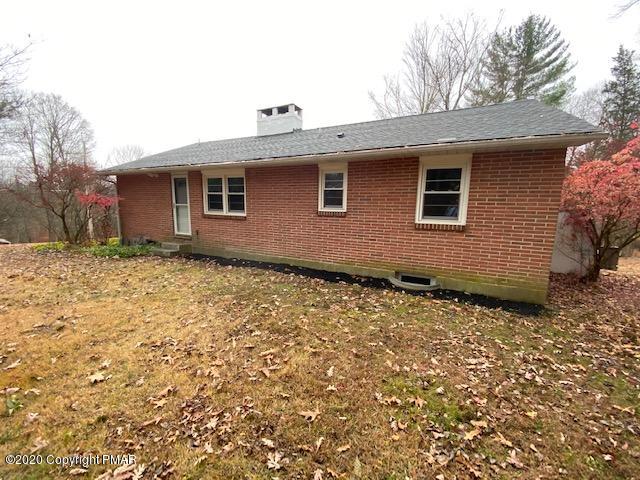 7522 Old Coach Road Stroudsburg, PA 18360 - Photo 8 of 68 a front view of a house with a yard