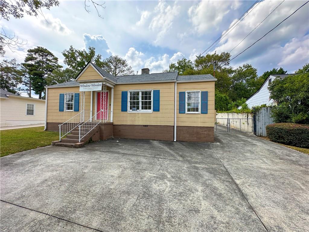 4154 Clairmont Road Chamblee, GA 30341 - Photo 2 of 9 a view of a house with a yard
