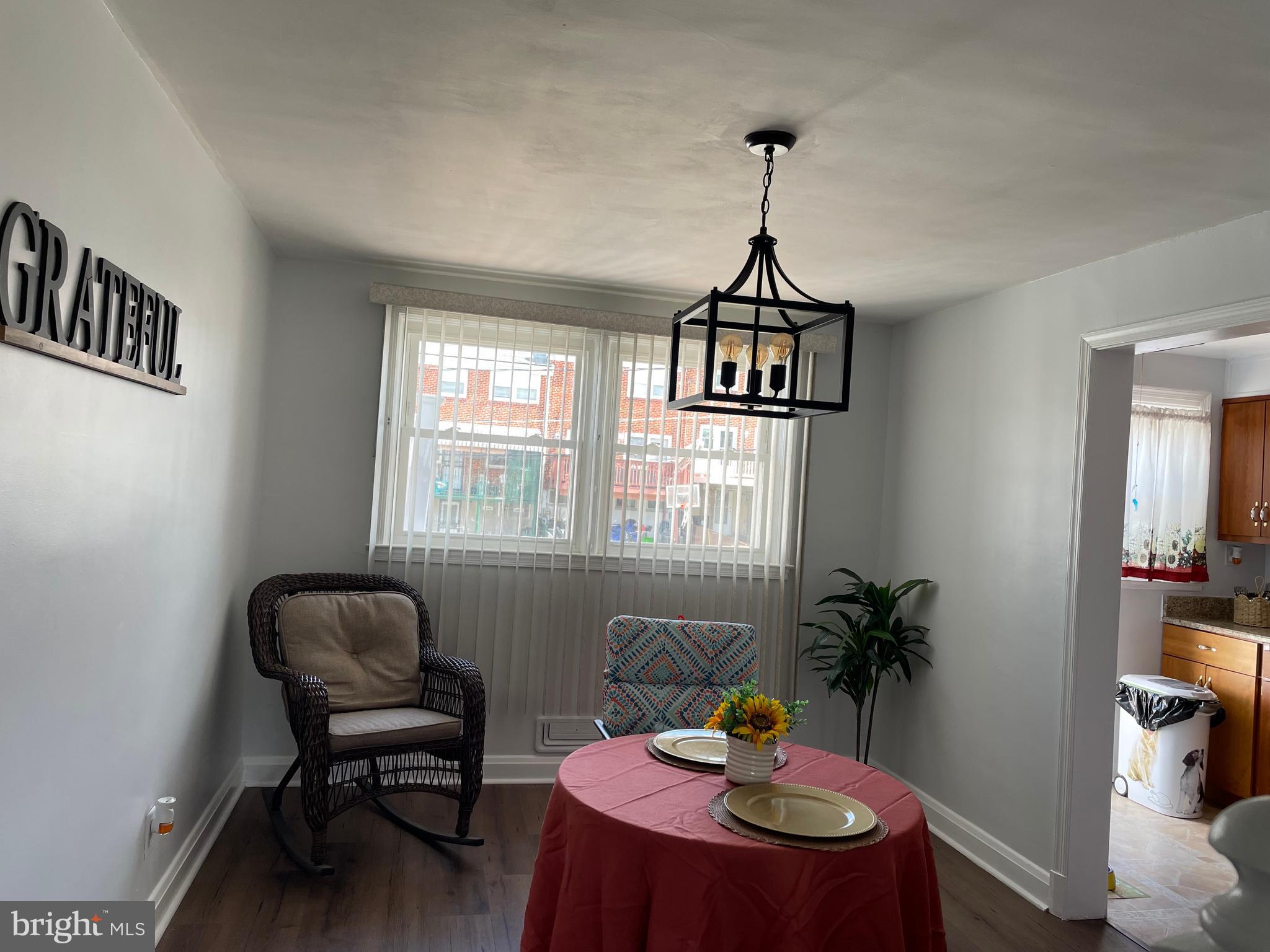 1407 Barrett Road Baltimore, MD 21207 - Photo 5 of 19 a table and chairs in a room