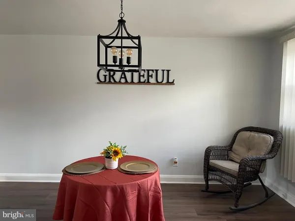 a view of a livingroom with furniture and entryway