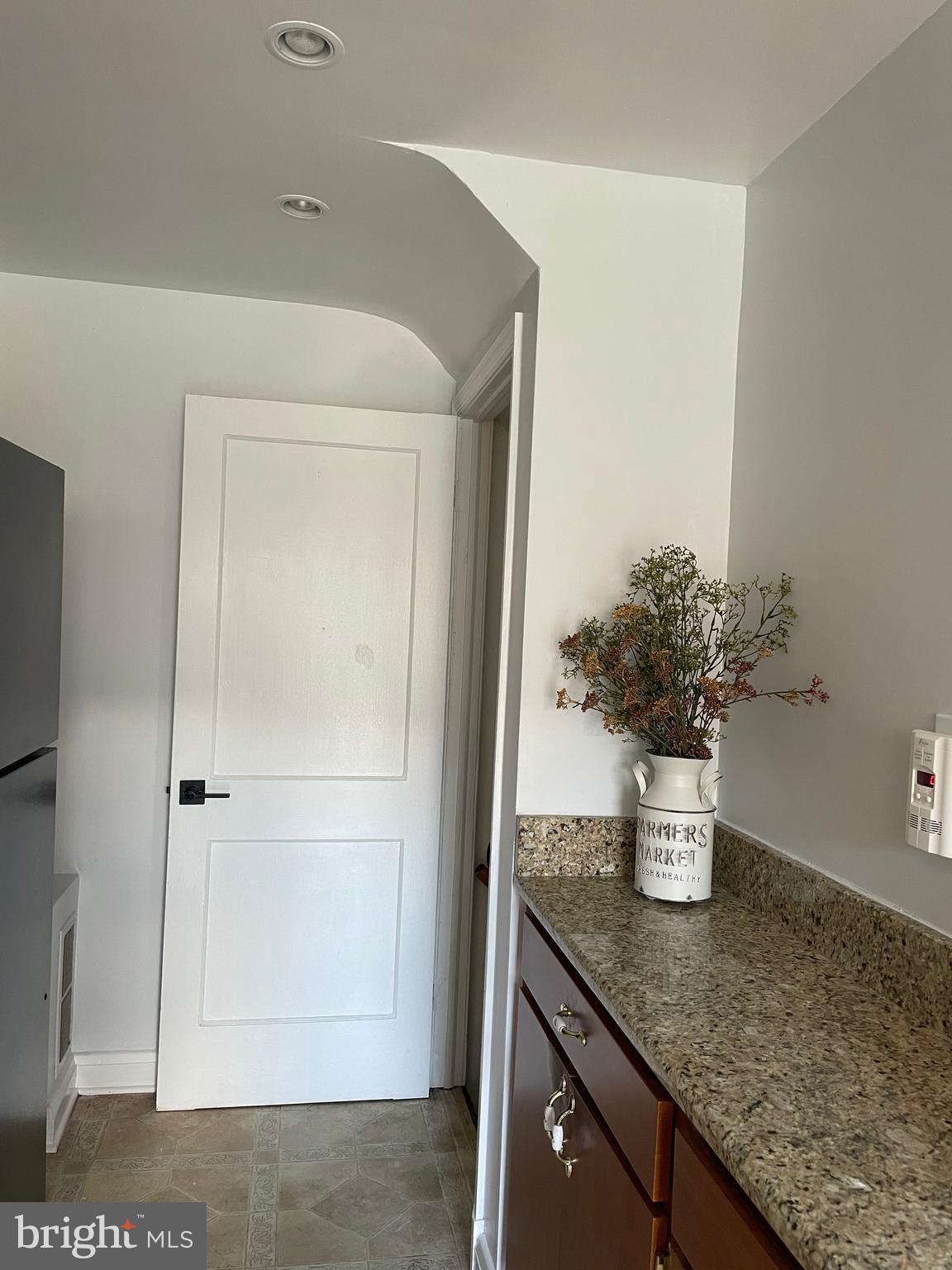 1407 Barrett Road Baltimore, MD 21207 - Photo 8 of 19 a kitchen with a sink and a potted plant