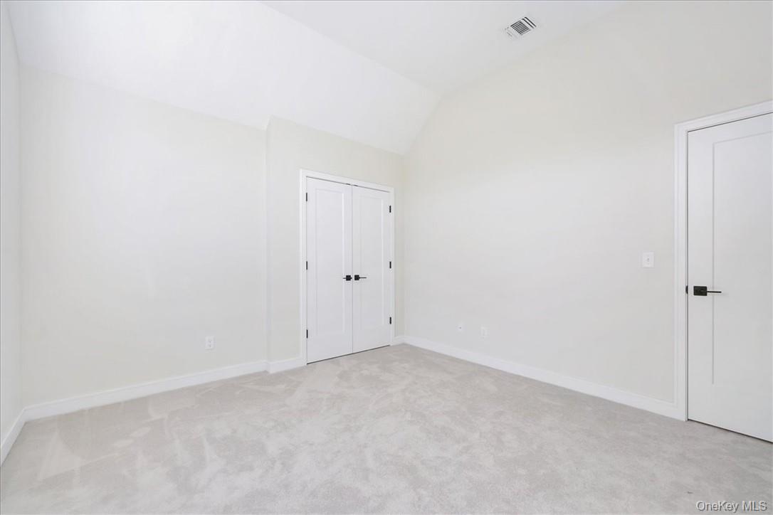 Lot 3-62 Camp Monroe Road Monroe, NY 10950 - Photo 27 of 39 Carpeted spare room featuring vaulted ceiling